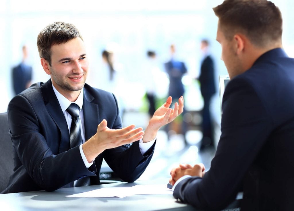 men discussing How to Find Investment Ideas