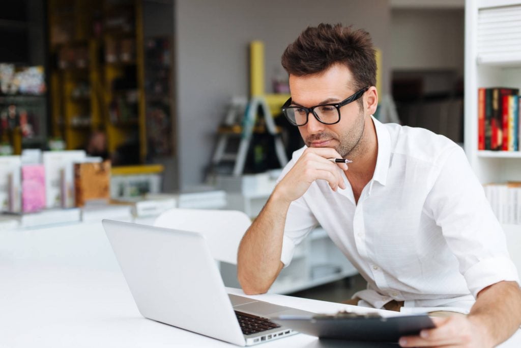 man looking at stocks