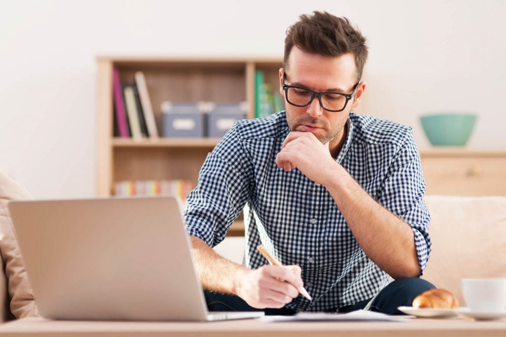 man looking at stocks