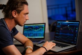 man-looking-at-stocks man-looking-at-stocks